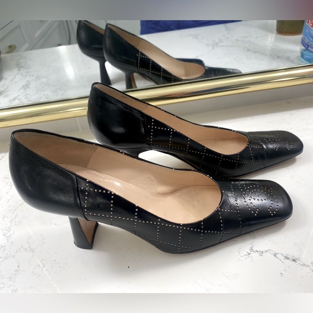 Gorgeous CHANEL heels black with bone colored quilting and CC monogram at toes.
